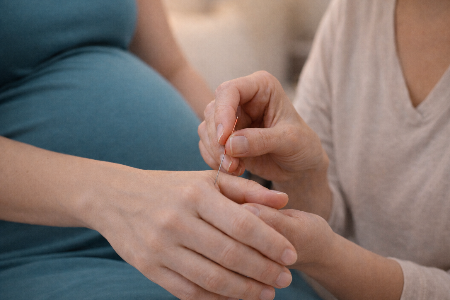 Pregnant woman receiving acupuncture treatment